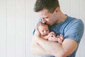 Blake cradling Eden Lidia, 8 days old